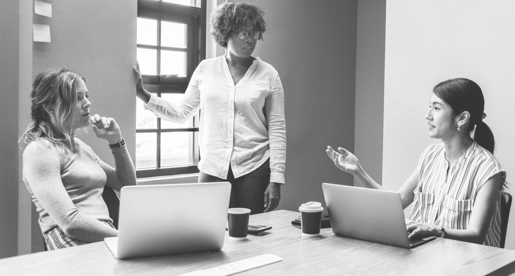 Team members collaborating in modern office environment